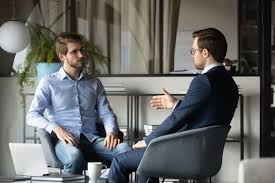 Senior executive engaged in a virtual one-on-one coaching session with a professional leadership coach