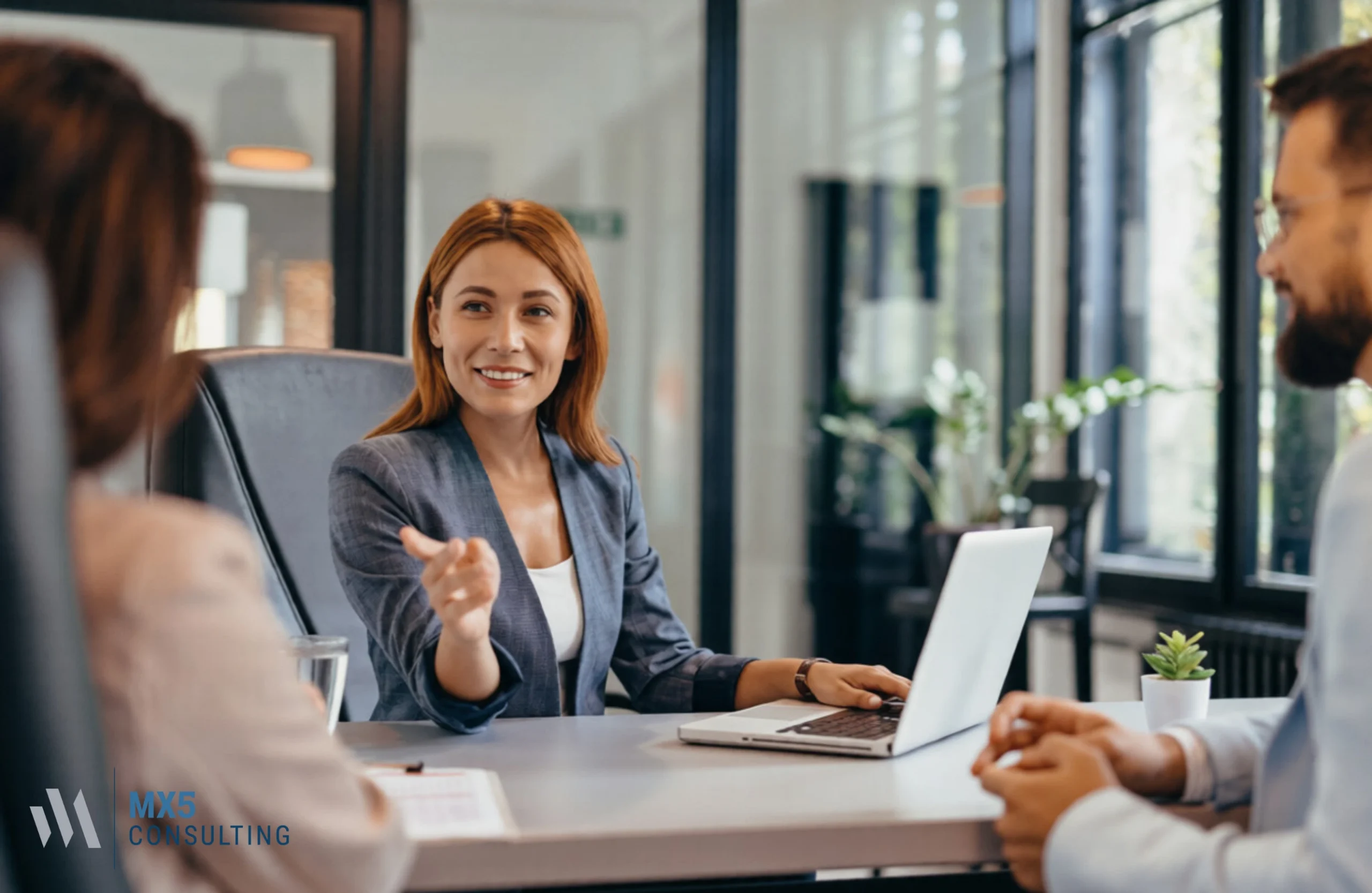 Executive team collaborating on strategic business consulting solutions to boost company performance